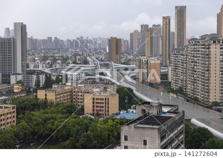 Aerial view of Wuhan city, the capital of Hubei, China. Rainy day Aerial view of Wuhan city, the capital of Hubei, China. Rainy day 141272604