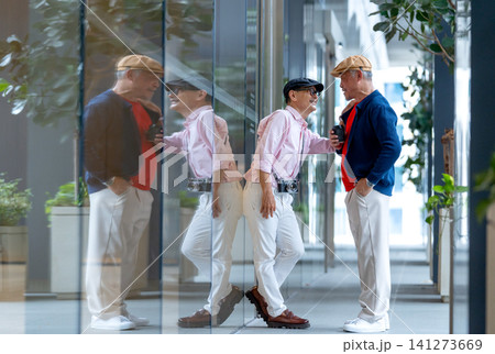 One Asian senior man look like lgbt touch and lean with the other man in front of glass wall to express happy in love. 141273669