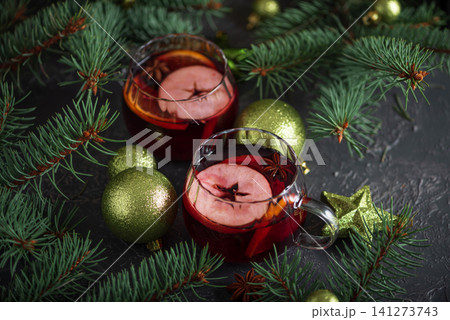 Mulled wine serving with Christmas spices and evergreen branches 141273743
