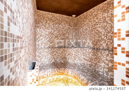 Modern steam room interior with mosaic tiles for wellness 141274587