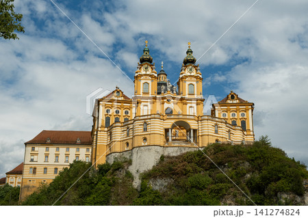 Scenic view of the majestic baroque Melk Abbey monastery on a rocky hill, Austria Scenic view of the majestic baroque Melk Abbey monastery on a rocky hill, Austria 141274824