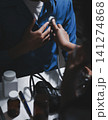 Doctor use stethoscope, checking up heart beat, auscultation in doctor office at hospital. Patient worker has to get medical checkup every year for her health or 141274868