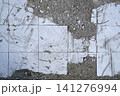 Floor surface with broken white tiles and concrete Floor surface with broken white tiles and concrete 141276994