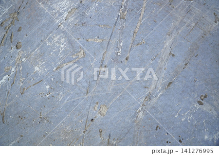 Grey concrete surface with many scratches 141276995