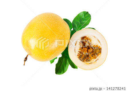 Whole yellow passion fruit with sliced half revealing aromatic pulp and seeds, complemented by fresh green leaves and isolated on a white background Whole yellow passion fruit with sliced half revealing aromatic pulp and seeds, complemented by fresh green leaves and isolated on a white background 141278241