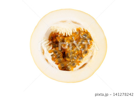 Close up of a sliced yellow passion fruit showing fresh pulp and seeds isolated on a white background 141278242