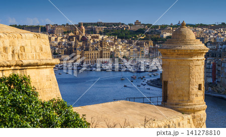 VALLETTA, MALTA - NOVEMBER 12, 2018 - Panoramic view of the Grand Harbor Tricity bay, Birgu and Senglea islands with ships and boats in the port VALLETTA, MALTA - NOVEMBER 12, 2018 - Panoramic view of the Grand Harbor Tricity bay, Birgu and Senglea islands with ships and boats in the port 141278810