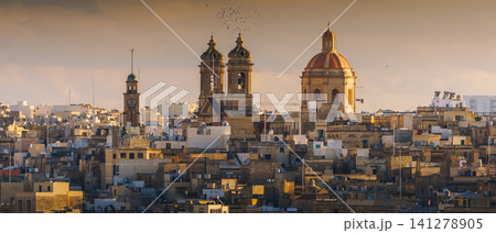 VALLETTA, MALTA - NOVEMBER 12, 2018 - Panoramic view of the Grand Harbor Tricity bay, Birgu and Senglea islands with ships and boats in the port VALLETTA, MALTA - NOVEMBER 12, 2018 - Panoramic view of the Grand Harbor Tricity bay, Birgu and Senglea islands with ships and boats in the port 141278905