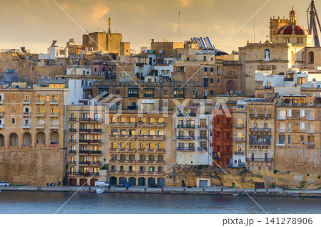 VALLETTA, MALTA - NOVEMBER 12, 2018 - Panoramic view of the Grand Harbor Tricity bay, Birgu and Senglea islands with ships and boats in the port VALLETTA, MALTA - NOVEMBER 12, 2018 - Panoramic view of the Grand Harbor Tricity bay, Birgu and Senglea islands with ships and boats in the port 141278906
