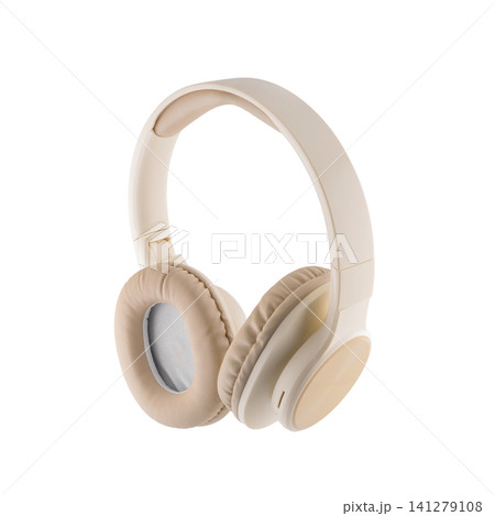 beige audio headphones turned backwards with an ear pad to the left on a white background beige audio headphones turned backwards with an ear pad to the left on a white background 141279108