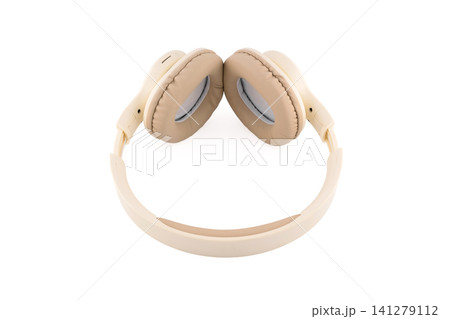 beige wireless headphones view from the side of soft ear pads beige wireless headphones view from the side of soft ear pads 141279112