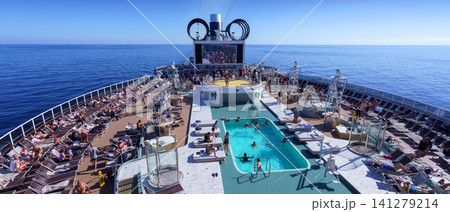 BARCELONA, SPAIN- 06 NOVEMBER, 2018: An aerial view of a cruise ship pool area with people in the open sea 141279214