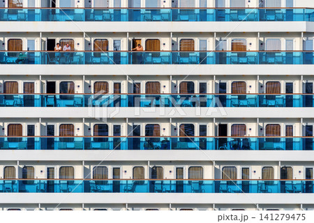MARSEILLE, FRANCE - 03 Nov 2018 - Cruise liner deck of blue and white colored stripes with people standing MARSEILLE, FRANCE - 03 Nov 2018 - Cruise liner deck of blue and white colored stripes with people standing 141279475