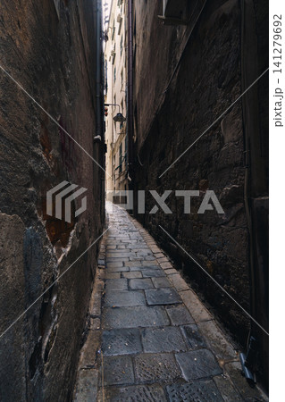 GENOA, ITALY - NOVEMBER 04, 2018 - Narrow streets of the old city GENOA, ITALY - NOVEMBER 04, 2018 - Narrow streets of the old city 141279692