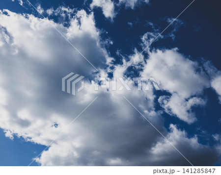 Dramatic cloudscape with puffy clouds Dramatic cloudscape with puffy clouds 141285847