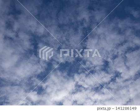 Dramatic cloudscape with puffy clouds Dramatic cloudscape with puffy clouds 141286149