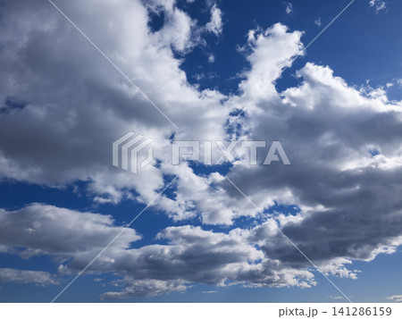 Dramatic cloudscape with puffy clouds Dramatic cloudscape with puffy clouds 141286159