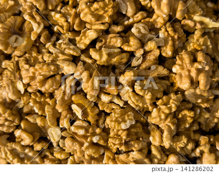 Shelled walnuts displayed at a traditional market stall Shelled walnuts displayed at a traditional market stall 141286202