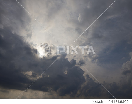 Dramatic cloudscape with puffy clouds Dramatic cloudscape with puffy clouds 141286800