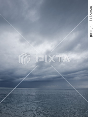 Dramatic sky and peaceful sea at sunrise Dramatic sky and peaceful sea at sunrise 141286801