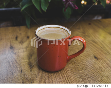 Morning americano served in red ceramic cup 141286813