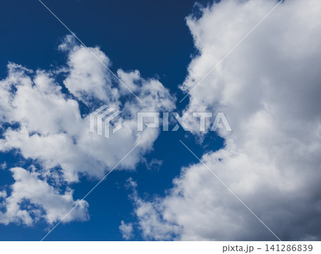 Dramatic cloudscape with puffy clouds Dramatic cloudscape with puffy clouds 141286839