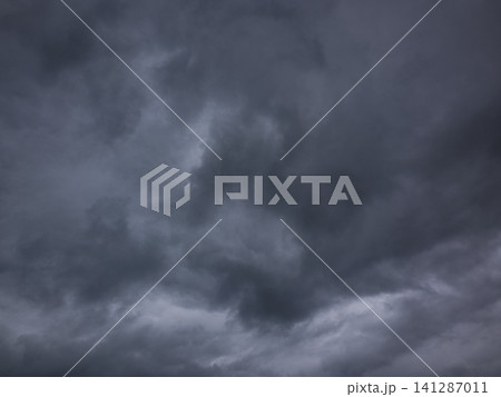 Dramatic thunderclouds covering the sky Dramatic thunderclouds covering the sky 141287011