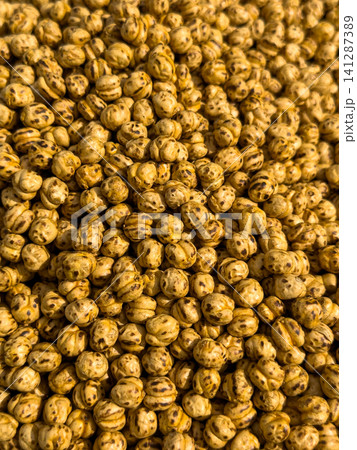 Fresh roasted chickpea snack on a local market counter Fresh roasted chickpea snack on a local market counter 141287389