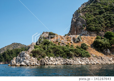 White rocky cliffs and green mountains in Marmaris Turkey White rocky cliffs and green mountains in Marmaris Turkey 141287643