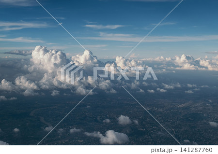 cityscape view from airplane with cloudy blue sky above, photo may has some noise cityscape view from airplane with cloudy blue sky above, photo may has some noise 141287760