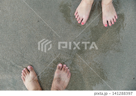 two feets of man and woman stand together on sand, abstract photograph, background, couple two feets of man and woman stand together on sand, abstract photograph, background, couple 141288397