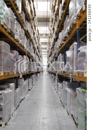 packing line in a logistics warehouse. conveyor belt in a modern production line. Pallet racking 141288430