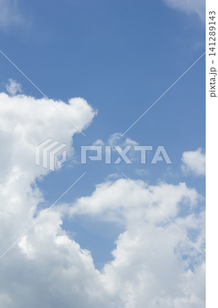 It is a blue sky with fluffy clouds. 141289143
