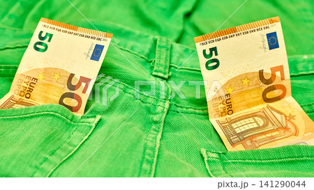 Insurance.Two 50 euro banknote in green jeans pockets Insurance.Two 50 euro banknote in green jeans pockets 141290044