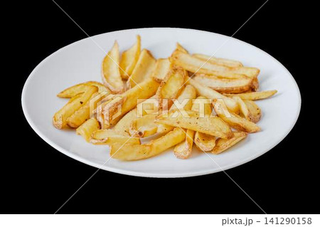Golden seasoned potato wedges served on white plate 141290158