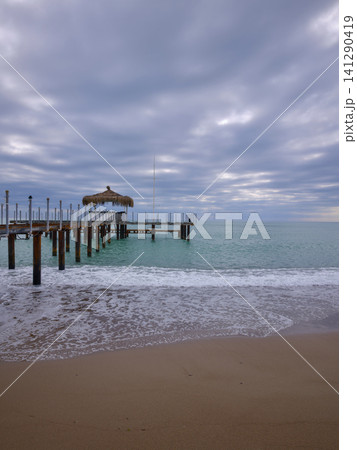 rustic industrial pier over the blue sea in a tropical landscape rustic industrial pier over the blue sea in a tropical landscape 141290419
