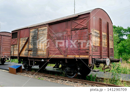 Vintage weathered wooden and metal freight train wagon on industrial tracks Vintage weathered wooden and metal freight train wagon on industrial tracks 141290709