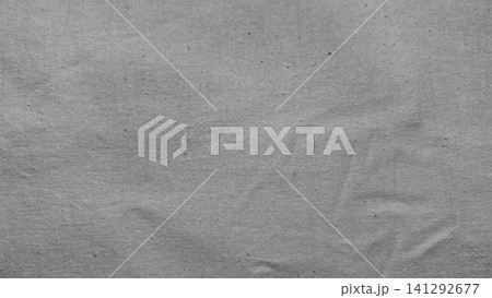 natural grey raw linen fabric background with organic cotton texture showing subtle creases and sustainable weaving weave natural grey raw linen fabric background with organic cotton texture showing subtle creases and sustainable weaving weave 141292677