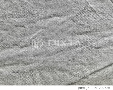textured wrinkled grey linen fabric background with natural creased organic canvas textile pattern textured wrinkled grey linen fabric background with natural creased organic canvas textile pattern 141292686
