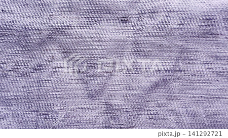 close up view of textured purple cotton fabric showing detailed woven thread patterns in abstract minimalistic styling 141292721