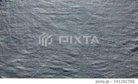 dark gray melange fabric texture shows organic horizontal slate lines creating a minimalist serene backdrop dark gray melange fabric texture shows organic horizontal slate lines creating a minimalist serene backdrop 141292788