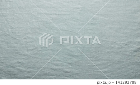 sage green linen fabric texture reveals organic woven yarn fiber in a minimalist serene flat lay composition 141292789