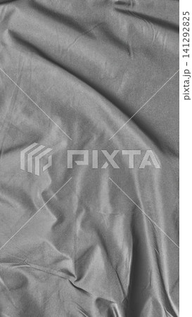 monochrome crumpled linen fabric texture creates abstract shadow pattern on sustainable textile background monochrome crumpled linen fabric texture creates abstract shadow pattern on sustainable textile background 141292825