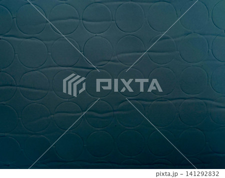 teal mattress protector fabric with geometric circle pattern offers serene minimalist background for wellness branding 141292832