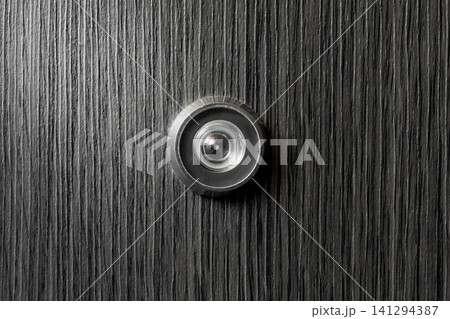 Peephole door eye look hole from spy security, safety close-up Peephole door eye look hole from spy security, safety close-up 141294387