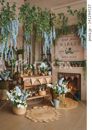 Cozy spring interior in rustic style with flowers and Easter decor 141294537
