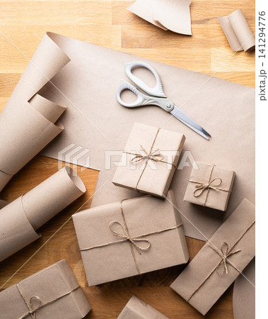 Wrapped Christmas Presents Craft Paper Background Wrapped Christmas Presents Craft Paper Background 141294776