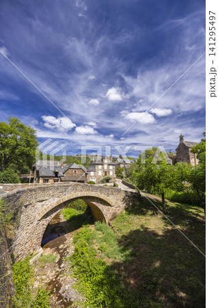 Sebrazac village and old stone bridge spanning stream 141295497