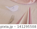 Romantic table setting with paper bird and pink accents Romantic table setting with paper bird and pink accents 141295508