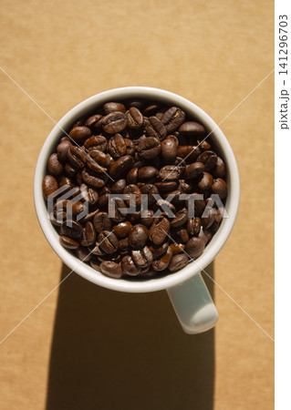 It is a mug and coffee beans. It is a mug and coffee beans. 141296703